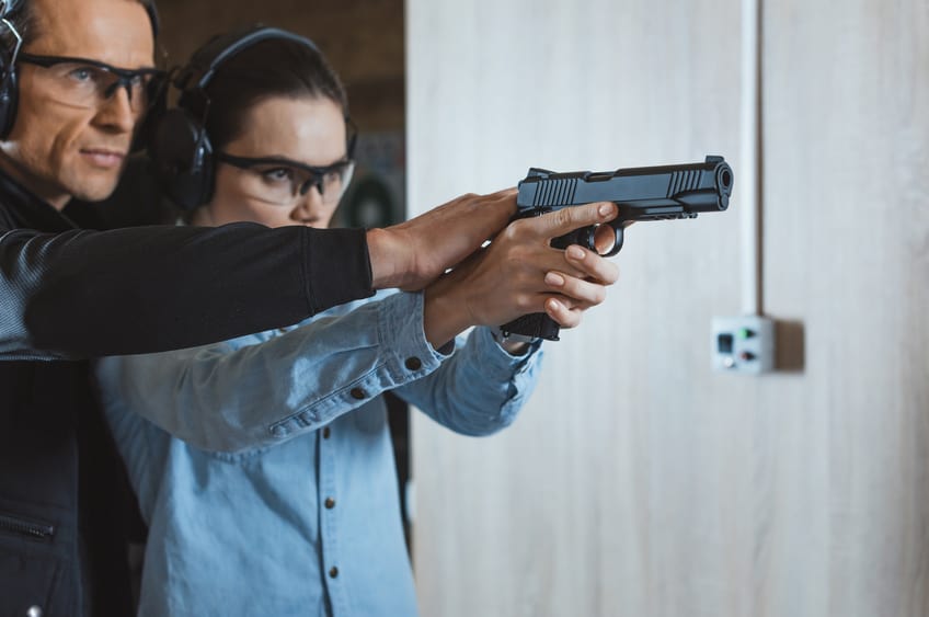 Armorer showing actress how to shoot a gun