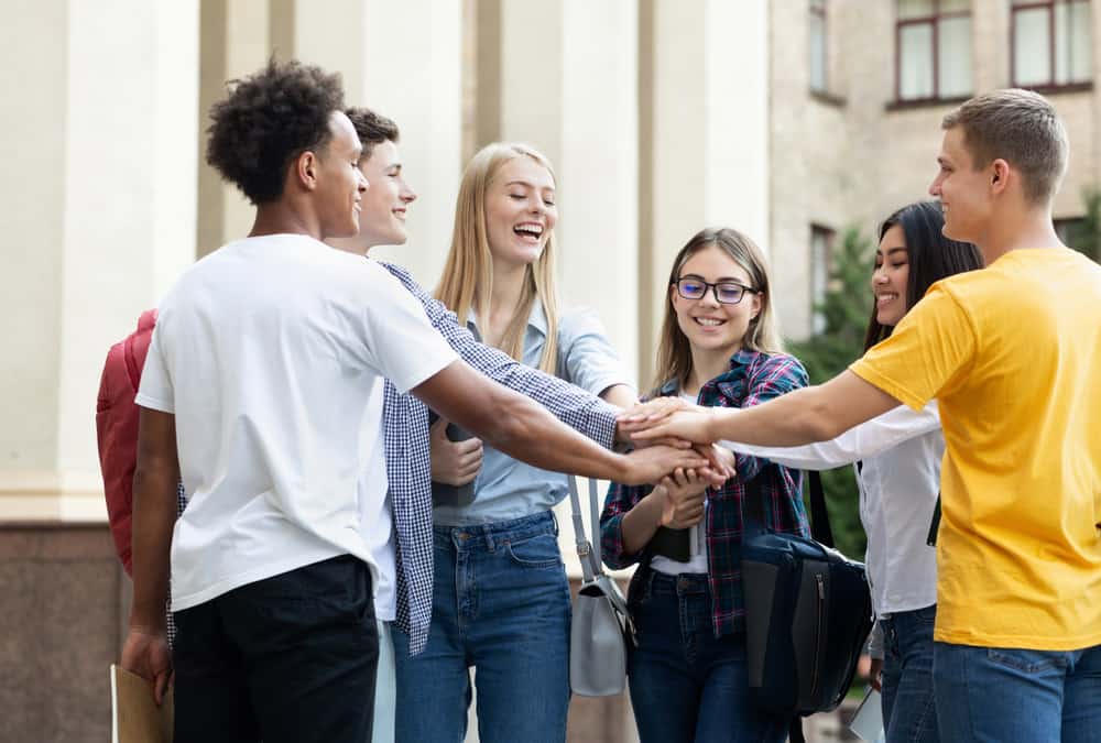 Diverse group of film school students on campus