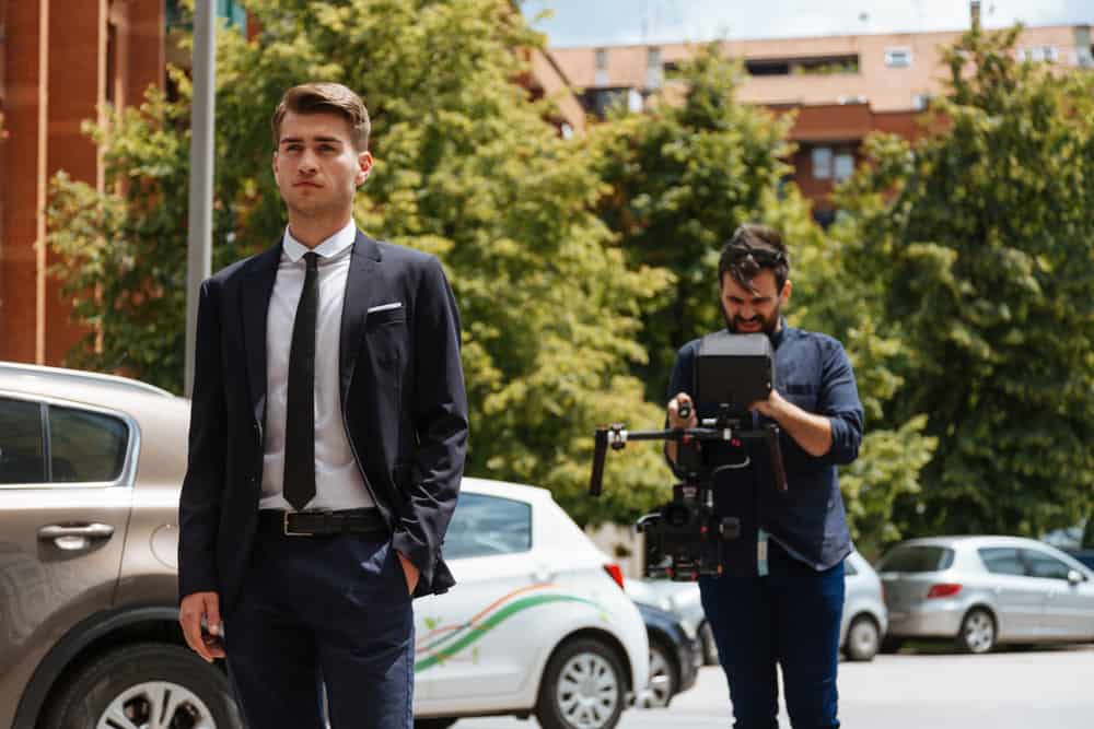 Actor and camera operator shooting a web series outdoors